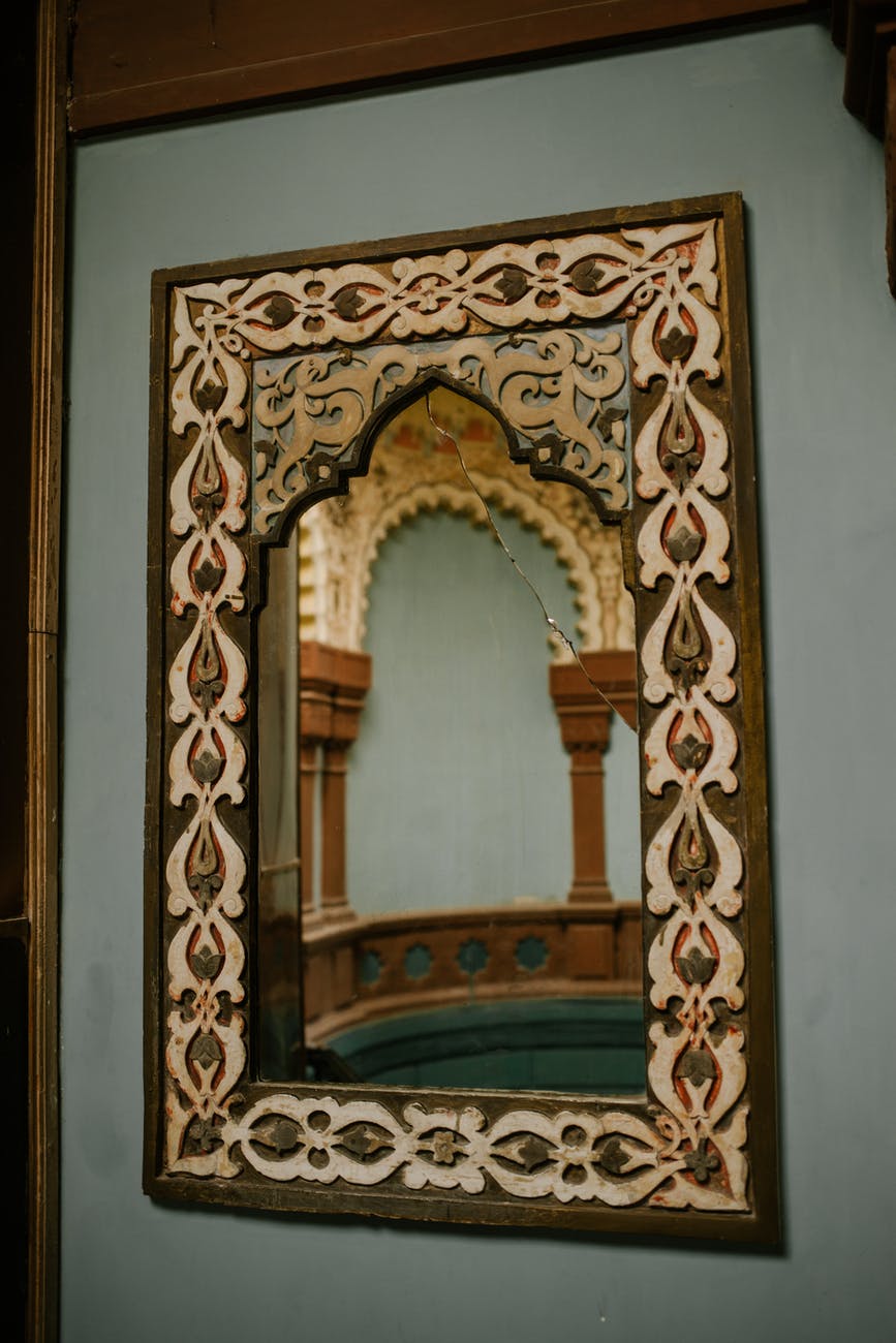 ornamental mirror on wall of oriental building